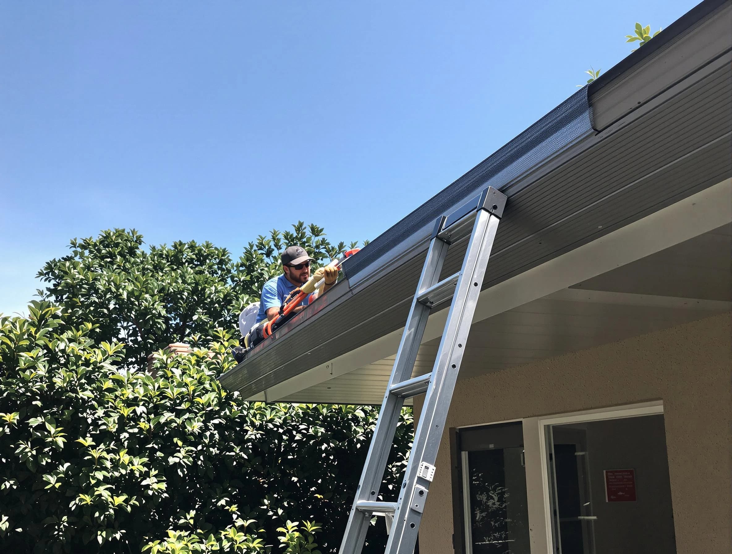 Strongsville Roofing Company installing gutter guards for a homeowner in Strongsville, OH